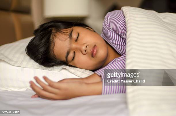 girl sleeping - asian sleeping stock pictures, royalty-free photos & images