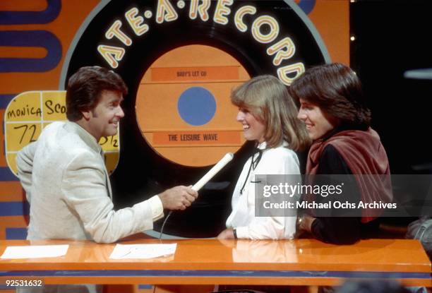 Host of the television series 'American Bandstand' Dick Clark asks members of the studio audience their opinions on a new release in 1980 in Los...