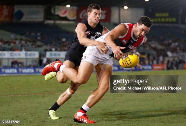 Paddy McCartin of the Saints and Lachie Plowman of the Blues compete for the ball during the AFL 2018 JLT Community Series match between the Carlton...