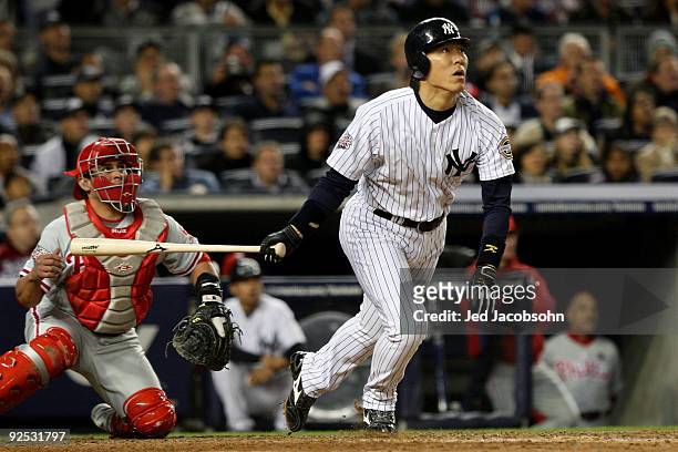 Hideki Matsui of the New York Yankees hits a solo home run in the sixth inning against the Philadelphia Phillies at Yankee Stadium on October 29,...