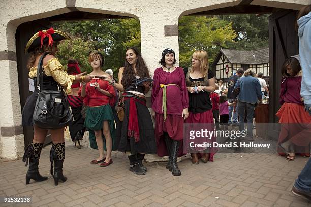 Crystal Zurn , Amanda Fuhrmann, Jessica Kelso and Linsey Acuti take tickets and greet visitors to the Maryland Renaissance Faire on September 26,...