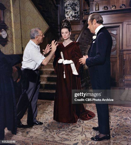 From left to right: Director George Sukor with Audrey Hepburn as Eliza Doolittle and Rex Harrison as Professor Henry Higgins in "My Fair Lady"....