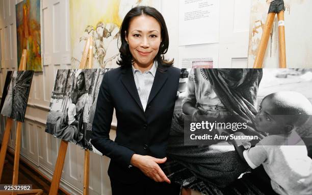 Television journalist Ann Curry stands with her photos from Sudan at Refugees International's "Images of Tragedy and Hope in Sudan" at The National...