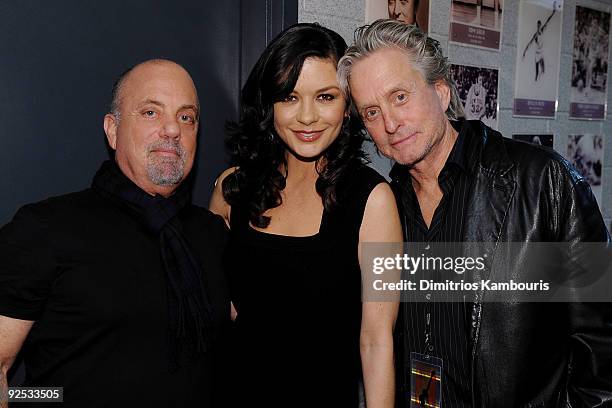 Billy Joel, Catherine Zeta-Jones and Michael Douglas attend the 25th Anniversary Rock & Roll Hall of Fame Concert at Madison Square Garden on October...