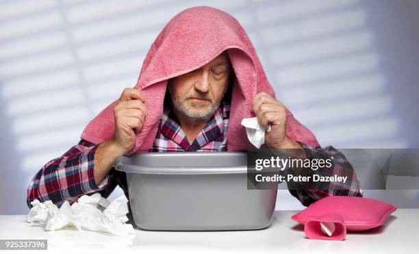 man flu, inhaling steam from a bowl - cold virus stock pictures, royalty-free photos & images