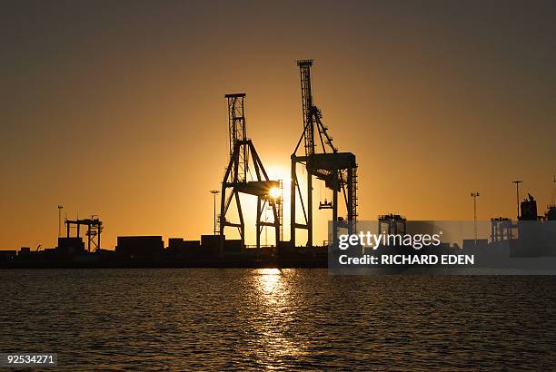 port cranes against sunset - fremantle stock pictures, royalty-free photos & images