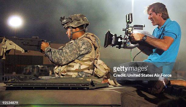 Movie director Michael Bay films an Airman on the set of the movie "Transformers" at Holloman Air Force Base, N.M., on May 30. Several Airmen filled...