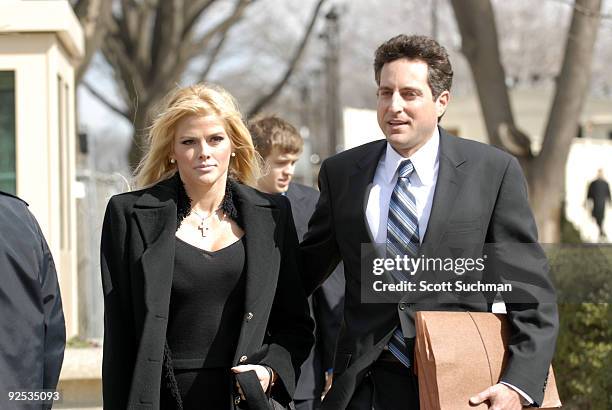 Former Playboy Playmate Anna Nicole Smith and her attorney Howard Stern leave the US Supreme Court in Washington, DC Tuesday afternoon after there...