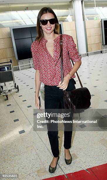 Model Miranda Kerr arrives at Sydney International Airport ahead of her appearance at the Caulfield Cup this weekend, on October 14, 2009 in Sydney,...