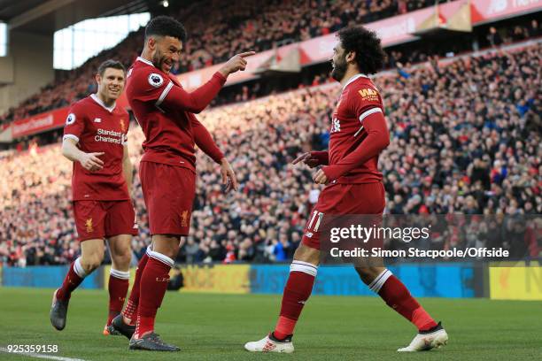 Mohamed Salah of Liverpool celebrates with teammates Alex Oxlade-Chamberlain and James Milner after scoring their 2nd goal during the Premier League...