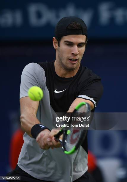 Karen Khachanov of Russia plays a forehand during his match against Lucas Pouille of France on day three of the ATP Dubai Duty Free Tennis...