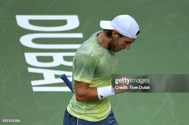 Lucas Pouille of France celebrates a point during his match against Karen Khachanov of Russia on day three of the ATP Dubai Duty Free Tennis...