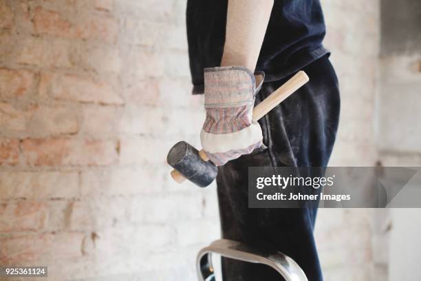 person holding hammer - dirty construction worker stock pictures, royalty-free photos & images