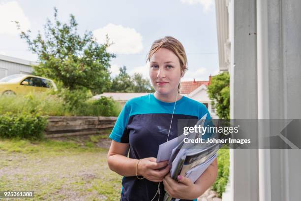 portrait of young female mail carrier - postal worker stock pictures, royalty-free photos & images