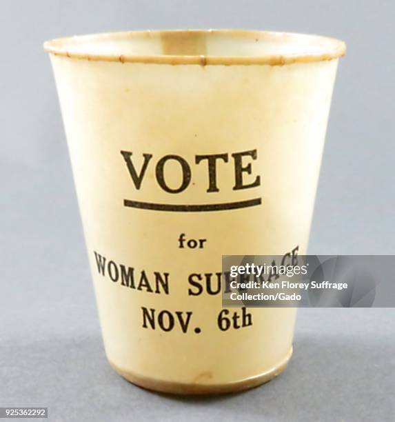 Wax coated paper cup, with black text on a white background, reading "Vote for Woman Suffrage Nov 6th, " produced for the successful New York State...