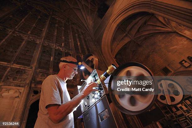 Projectionist shows the film Harry Potter and the Half-Blood Prince on a giant screen inside Gloucester Cathedral on October 29, 2009 in Gloucester,...