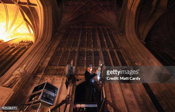 Projectionist shows the film Harry Potter and the Half-Blood Prince on a giant screen inside Gloucester Cathedral on October 29, 2009 in Gloucester,...