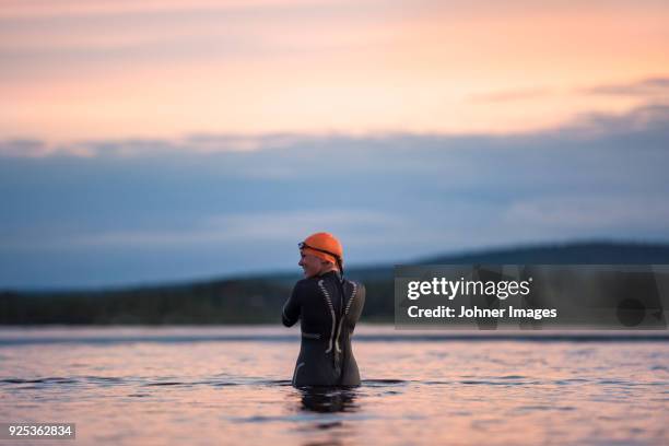 woman in lake - cold temperature outside stock pictures, royalty-free photos & images