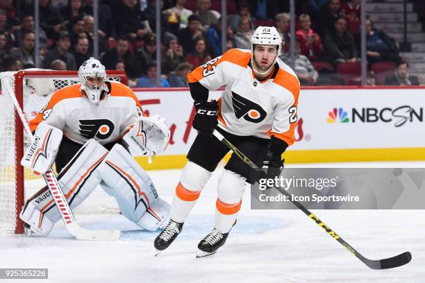 Philadelphia Flyers Defenceman Brandon Manning tracks the play while standing in front of Philadelphia Flyers Goalie Petr Mrazek during the...