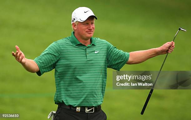 Richard Finch of England reacts to a shot on the 3rd green during Round Two of the Barclays Singapore Open at Sentosa Golf Club on October 30, 2009...