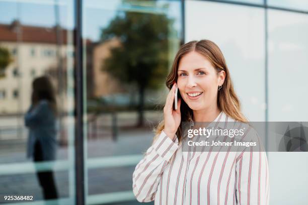 young woman talking on cell phone - helsingborg if stock pictures, royalty-free photos & images