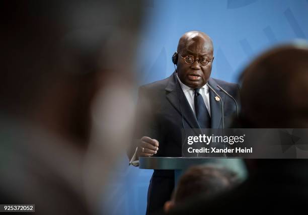 The President of Ghana, Nana Addo Dankwa Akufo-Addo, speaks at a press conference at the Chancellery, on February 28, 2018 in Berlin, Germany. Among...