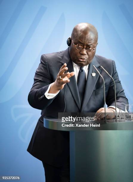 The President of Ghana, Nana Addo Dankwa Akufo-Addo, speaks at a press conference at the Chancellery, on February 28, 2018 in Berlin, Germany. Among...