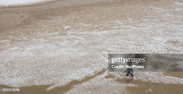 Snow storm leaves the beach of the shell under a white robe in San Sebastian, Spain, at February 28, 2018