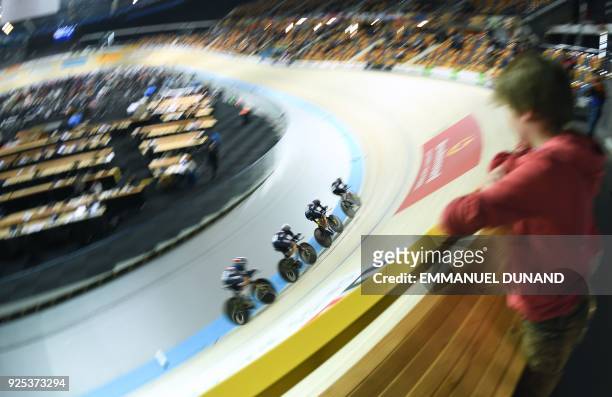 France's team competes in the Women's Team Pursuit qualifying round during the UCI Track Cycling World Championships in Apeldoorn on Februray 28,...