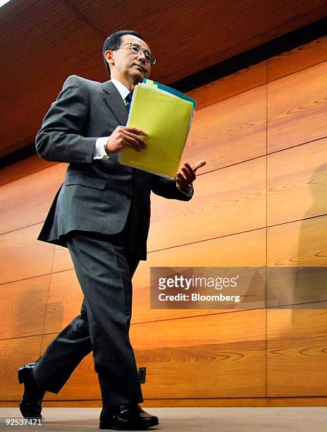 Masaaki Shirakawa, governor of the Bank of Japan, leaves a news conference in Tokyo, Japan, on Friday, Oct. 30, 2009. The Bank of Japan said it will...