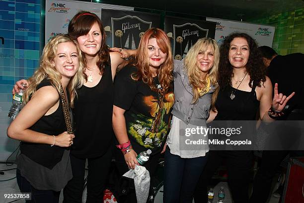 From 2nd left, Brett Anderson, Maya Ford, Allison Robertson and Amy Cesari of The Donnas pose for pictures at the NBC Experience Store as part of the...
