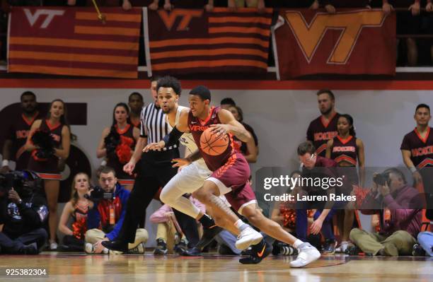 Nickeil Alexander-Walker of the Virginia Tech Hokies dribbles the ball while being defended by Gary Trent, Jr. #2 of the Duke Blue Devils during the...