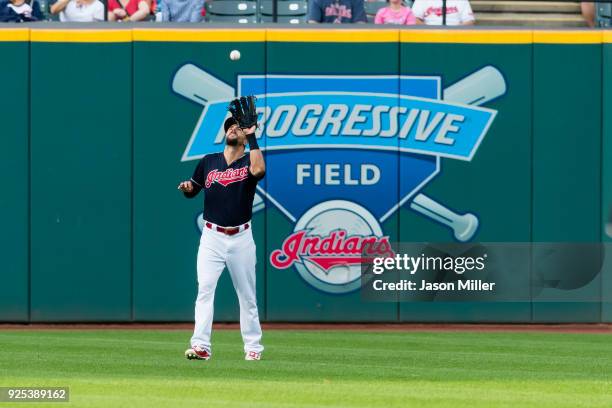 Right fielder Lonnie Chisenhall of the Cleveland Indians catches fly ball hit by Jose Pirela of the San Diego Padres during the first inning at...