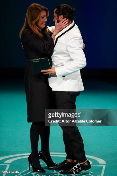 Spanish dancer Rafael Amargo receives the medal from President of Andalusia Susana Diaz during the Medal of Andalucia awards 2018 at the Teatro la...
