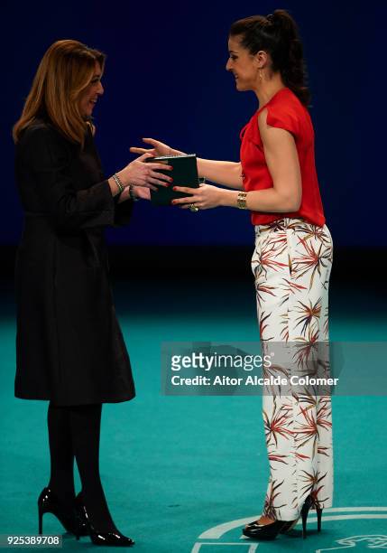 Spanish athlete Carolina Marin receives the medal from President of Andalusia Susana Diaz during the Medal of Andalucia awards 2018 at the Teatro la...