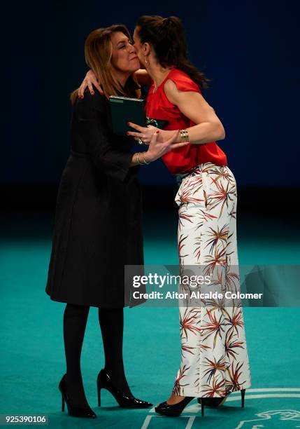 Spanish athlete Carolina Marin receives the medal from President of Andalusia Susana Diaz during the Medal of Andalucia awards 2018 at the Teatro la...