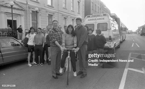 Dublin Football Stars Keith Barr and Mick Galvin are pictured as they give a shove-off to Catherine McDonnell of the Nursing staff of Temple Street...