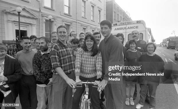 Dublin Football Stars Keith Barr and Mick Galvin are pictured as they give a shove-off to Catherine McDonnell of the Nursing staff of Temple Street...