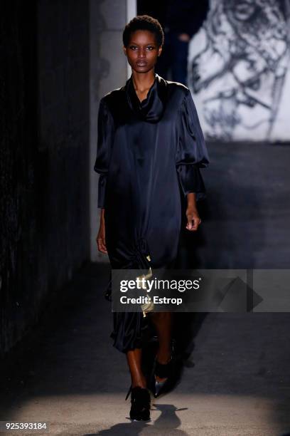 Model walks the runway during the Victoria/Tomas show as part of the Paris Fashion Week Womenswear Fall/Winter 2018/2019 on February 27, 2018 in...