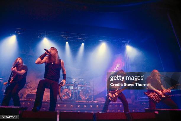 Johan Soderberg, Johan Hegg, Ted Lundstrom and Olavi Mikkonen of Amon Amarth perform on stage at Wulfrun Hall on October 28, 2009 in Wolverhampton,...