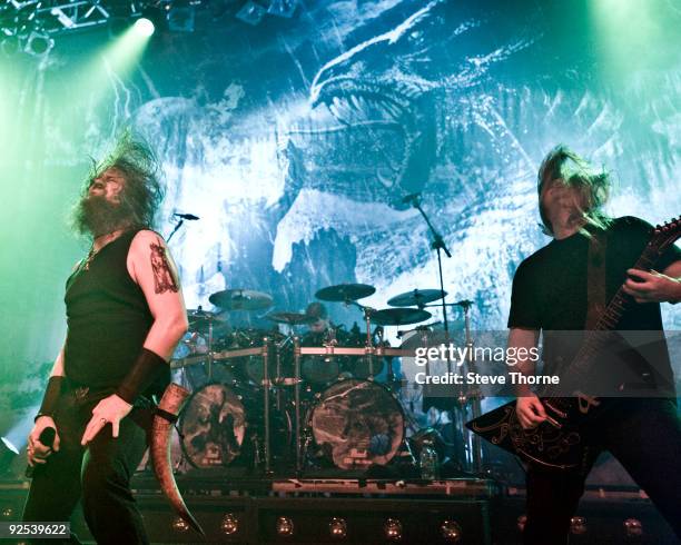 Johan Hegg and Olavi Mikkonen of Amon Amarth perform on stage at Wulfrun Hall on October 28, 2009 in Wolverhampton, England.