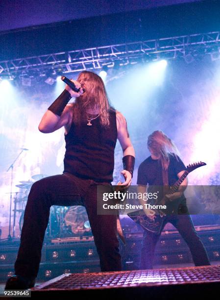 Johan Hegg and Olavi Mikkonen of Amon Amarth perform on stage at Wulfrun Hall on October 28, 2009 in Wolverhampton, England.