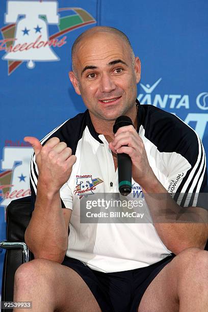 Tennis Star Andre Agassi and a member of the Philadelphia Freedoms WTT attends a match against the Boston Lobsters at the King of Prussia Mall July...