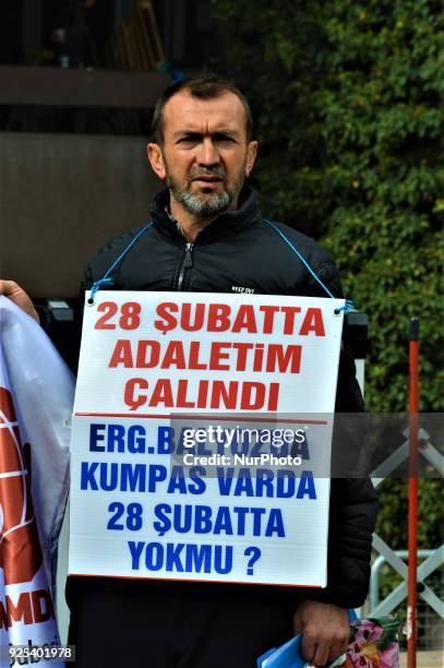 Man wears a placard as an organized group of pro-Islamic demonstrators makes a statement outside the main courthouse on the 21th anniversary of...