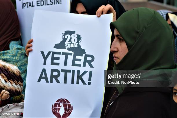 Woman holds up a placard as an organized group of pro-Islamic demonstrators makes a statement outside the main courthouse on the 21th anniversary of...