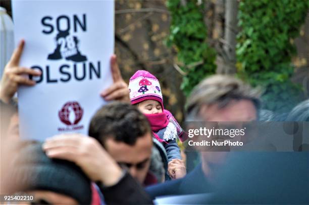 Baby is seen as an organized group of pro-Islamic demonstrators makes a statement outside the main courthouse on the 21th anniversary of Turkey's...