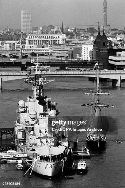 The Sir Winston Churchill, the Sail Training Association's three-masted schooner, moors alongside HMS Belfast on the River thames in London.