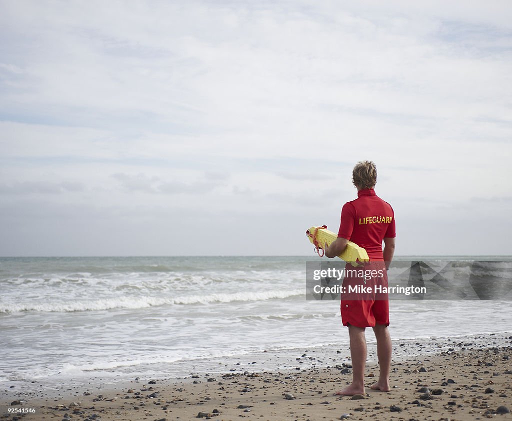 Lifeguard on Beach looking at the sea