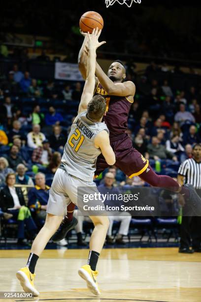 Central Michigan Chippewas forward Cecil Williams shoots over Toledo Rockets guard Dylan Alderson during a regular season Mid-American Conference...