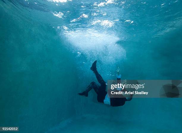 businessman falling under water - under sink stock pictures, royalty-free photos & images